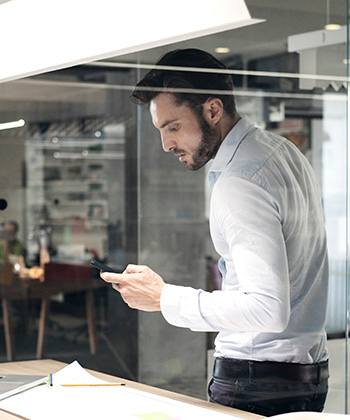 Mobility grows, but printing stays essential guy using phone